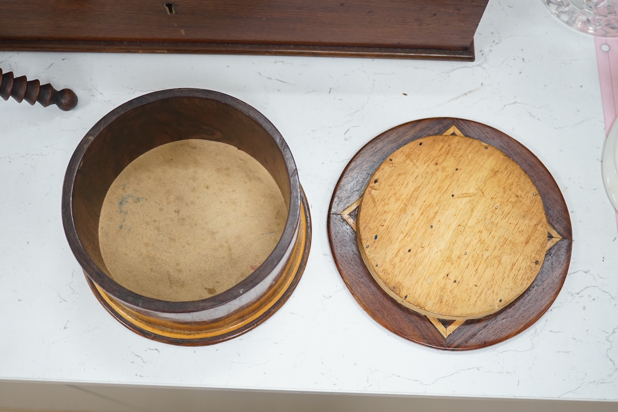 19th/early 20th century woodenware to include Pitcairn Islands circular box and treen ‘cat’ or plate stand, largest 44cm wide. Condition - fair to good